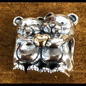 Brand new Pandora hugging bears with gold heart.
